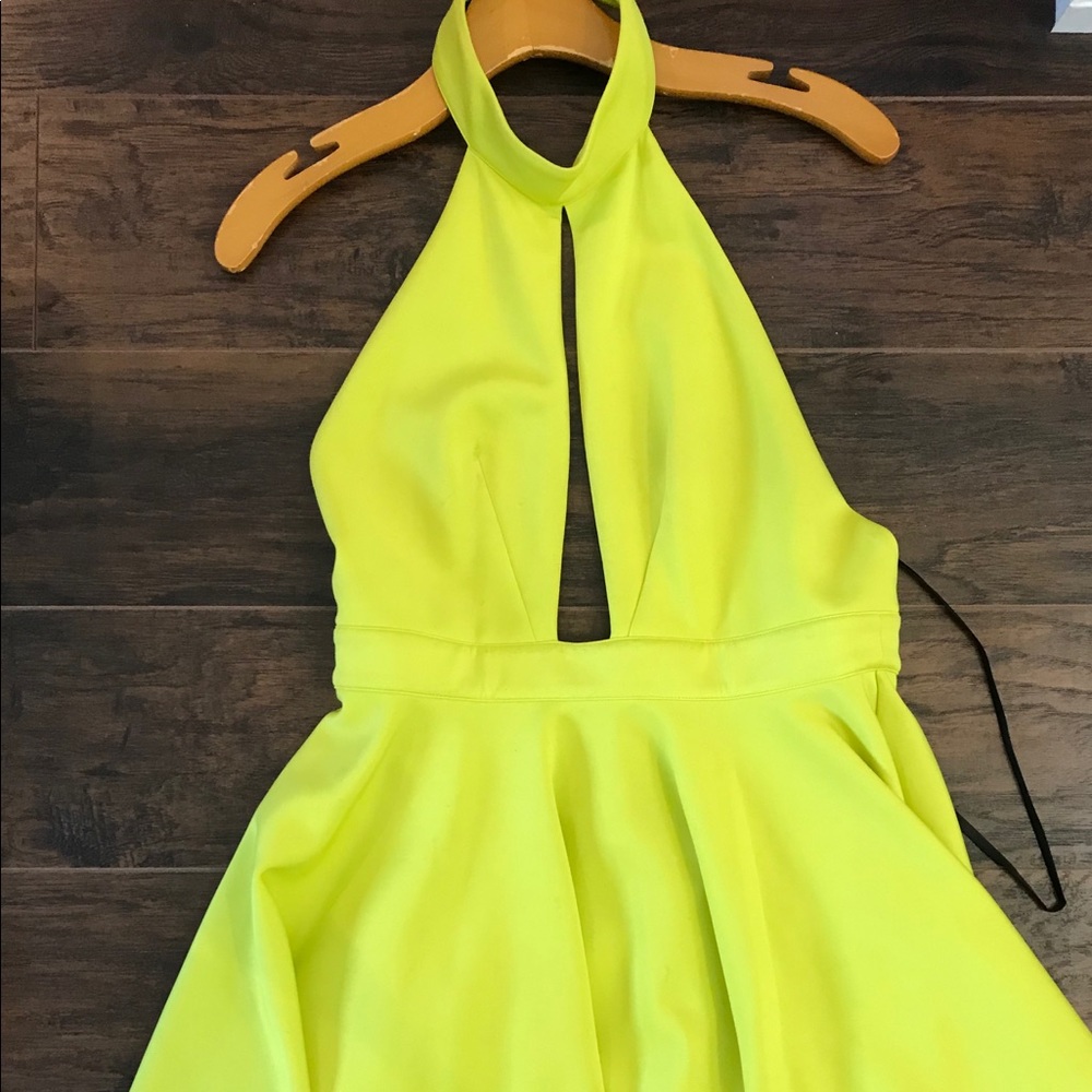 Neon green Bebe dress with open back